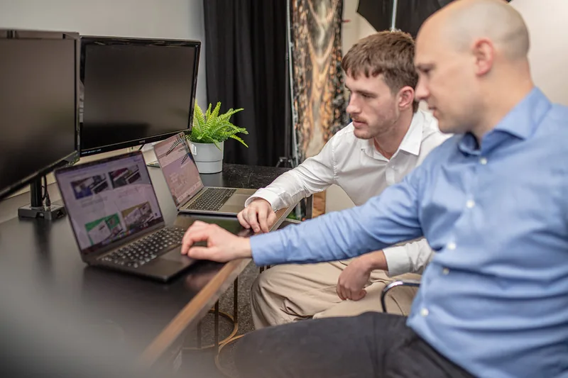 David and Luke from Halizona checking search results on two laptops